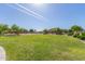 Expansive community lawn, perfect for outdoor activities and gatherings, surrounded by lush landscaping and well-maintained grounds at 852 E Mountain View Rd # 18, San Tan Valley, AZ 85143