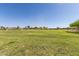 Expansive community lawn, great for recreation and community events, in a well-maintained and landscaped environment at 852 E Mountain View Rd # 18, San Tan Valley, AZ 85143