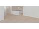 Spacious living area with neutral carpet, white walls, and plenty of natural light at 852 E Mountain View Rd # 18, San Tan Valley, AZ 85143