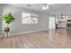 Inviting living space with wood-look floors, sliding glass doors, and an open layout at 852 E Mountain View Rd # 18, San Tan Valley, AZ 85143