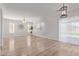 Open-concept living room boasts wood-look floors and ample natural light at 852 E Mountain View Rd # 18, San Tan Valley, AZ 85143