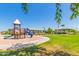Community playground and picnic area featuring slides, climbing structures, and shaded seating at 852 E Mountain View Rd # 18, San Tan Valley, AZ 85143