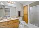Bathroom featuring vanity, toilet and enclosed shower in a well lit space at 858 S Portland --, Mesa, AZ 85206