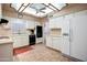 Bright kitchen with ample white cabinetry, tiled floors, and modern appliances, offering practical elegance at 858 S Portland --, Mesa, AZ 85206