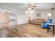 Spacious living room showcasing hardwood floors and neutral walls, complemented by ceiling fans at 858 S Portland --, Mesa, AZ 85206