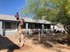 This cozy covered patio offers a relaxing outdoor space for entertaining and enjoying the backyard views at 9327 E Des Moines St, Mesa, AZ 85207