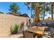 Fully fenced backyard with outdoor furniture, a dining table, and desert landscaping at 945 N Pasadena -- # 62, Mesa, AZ 85201