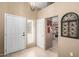 Welcoming home foyer with tile flooring, a charming chandelier, and easy access to the kitchen area at 945 N Pasadena -- # 62, Mesa, AZ 85201