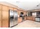 Spacious kitchen with stainless steel appliances, plenty of counter space, and wooden cabinets providing ample storage at 945 N Pasadena -- # 62, Mesa, AZ 85201