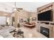Open-concept living room with tile floors, fireplace, and access to the dining area at 945 N Pasadena -- # 62, Mesa, AZ 85201