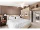 Spacious main bedroom with a ceiling fan, side tables, and an ensuite bathroom at 945 N Pasadena -- # 62, Mesa, AZ 85201