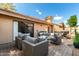 Covered patio with outdoor furniture, recessed lighting, and a desert landscaped backyard at 945 N Pasadena -- # 62, Mesa, AZ 85201