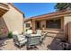 Inviting outdoor patio with a stylish seating area and well-maintained pavers, ideal for outdoor dining at 945 N Pasadena -- # 62, Mesa, AZ 85201