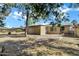 This backyard is fully fenced in and includes patio with a large mature tree providing shade at 9522 E Quarterline Rd, Mesa, AZ 85207