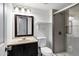 Well-lit bathroom with tiled glass shower, vanity, and modern toilet at 9522 E Quarterline Rd, Mesa, AZ 85207