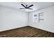 Bright bedroom features wood-style tile floors, a window, and a built-in shelf at 9522 E Quarterline Rd, Mesa, AZ 85207