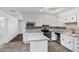 Well-lit kitchen features stainless steel appliances, a center island and ample storage space at 9522 E Quarterline Rd, Mesa, AZ 85207