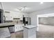 Bright kitchen featuring stainless appliances, and an eat-in island at 9522 E Quarterline Rd, Mesa, AZ 85207