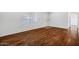 Inviting living room with hardwood floors and lots of natural light at 9522 E Quarterline Rd, Mesa, AZ 85207