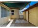 Covered backyard patio area features weathered siding and offers a relaxing outdoor space at 9522 E Quarterline Rd, Mesa, AZ 85207