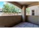 Cozy balcony view featuring an open-air space, stucco walls, and a view of mature trees at 9550 E Thunderbird Rd # 149, Scottsdale, AZ 85260
