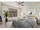 Comfortable bedroom with window letting in natural light, ceiling fan, and stylish decor at 9550 E Thunderbird Rd # 149, Scottsdale, AZ 85260