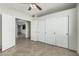 Spacious bedroom boasts tile flooring, closet doors, and access to other rooms at 9550 E Thunderbird Rd # 149, Scottsdale, AZ 85260