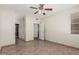 Spacious bedroom boasts tile flooring, closet doors, and adjoining bathroom entrance at 9550 E Thunderbird Rd # 149, Scottsdale, AZ 85260