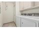 Laundry room equipped with washer, dryer and cabinets for storage at 9550 E Thunderbird Rd # 149, Scottsdale, AZ 85260