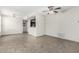 Spacious living area featuring tile floors, ceiling fan, neutral walls, and an open view of the kitchen at 9550 E Thunderbird Rd # 149, Scottsdale, AZ 85260