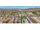 Scenic aerial view showcasing the neighborhood, nearby desert landscape, and easy access to major roadways at 9570 W Quail Track Dr, Peoria, AZ 85383
