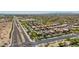 Aerial view of a suburban neighborhood with swimming pools and well-manicured yards at 9570 W Quail Track Dr, Peoria, AZ 85383