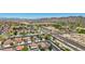 Expansive aerial shot featuring rooftops and landscaping, near highway offering convenient commuting at 9570 W Quail Track Dr, Peoria, AZ 85383