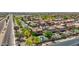 An aerial view of a community features homes with pools and well-maintained landscaping at 9570 W Quail Track Dr, Peoria, AZ 85383