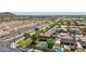 Aerial view showcases homes with pools and manicured yards in a desert community at 9570 W Quail Track Dr, Peoria, AZ 85383