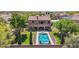 Aerial view showcasing a private backyard, sparkling pool, and manicured landscaping at 9570 W Quail Track Dr, Peoria, AZ 85383
