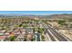 Scenic aerial view showcasing the neighborhood, nearby desert landscape, and easy access to major roadways at 9570 W Quail Track Dr, Peoria, AZ 85383