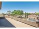 Spacious balcony overlooking a lush backyard with a sparkling pool, perfect for outdoor relaxation at 9570 W Quail Track Dr, Peoria, AZ 85383