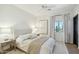 Cozy bedroom with a ceiling fan, stylish decor, and a bright window offering natural light at 9570 W Quail Track Dr, Peoria, AZ 85383