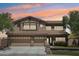 Elegant two-story home with a three-car garage and beautiful stone accents at 9570 W Quail Track Dr, Peoria, AZ 85383