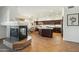 A spacious kitchen boasts dark wood cabinetry, a center island, and stainless steel appliances at 9570 W Quail Track Dr, Peoria, AZ 85383