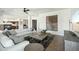 A spacious living room features neutral tones, stylish decor, and an open layout at 9570 W Quail Track Dr, Peoria, AZ 85383