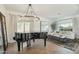 Bright living area with piano, stylish decor, comfortable seating, and bright natural light at 9570 W Quail Track Dr, Peoria, AZ 85383