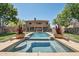 Gorgeous pool and spa area with fountains and lush landscaping, perfect for relaxing outdoors at 9570 W Quail Track Dr, Peoria, AZ 85383