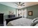 Comfortable bedroom with a dresser, windows, and serene decor, creating a relaxing retreat at 9642 E Irwin Ave, Mesa, AZ 85209