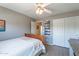 Bedroom featuring ceiling fan, closet, and light wood floors at 9642 E Irwin Ave, Mesa, AZ 85209