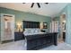 Bedroom with large bed, windows, and an en-suite bathroom for convenience and privacy at 9642 E Irwin Ave, Mesa, AZ 85209