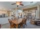 Dining area with an open layout, a wooden table and chairs, and seamless connectivity to the kitchen at 9642 E Irwin Ave, Mesa, AZ 85209