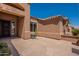 View of private entrance featuring a decorative security door and large flagstone patio at 9642 E Irwin Ave, Mesa, AZ 85209