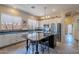 Modern kitchen with sleek countertops, stainless steel appliances, and a black island with seating at 9642 E Irwin Ave, Mesa, AZ 85209